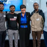 President Mantella standing with four other event guests